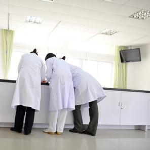 Nurses standing at a table