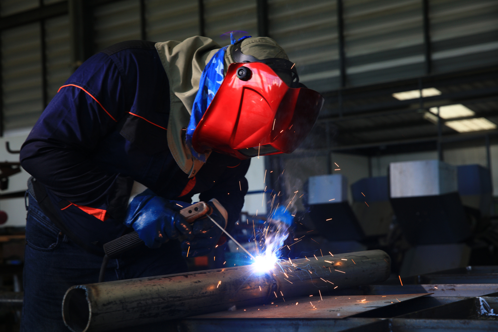 Manufacturing professionals collaborating on the factory floor