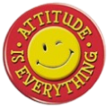 Red circular badge with a yellow smiley face and Attitude is Everything text