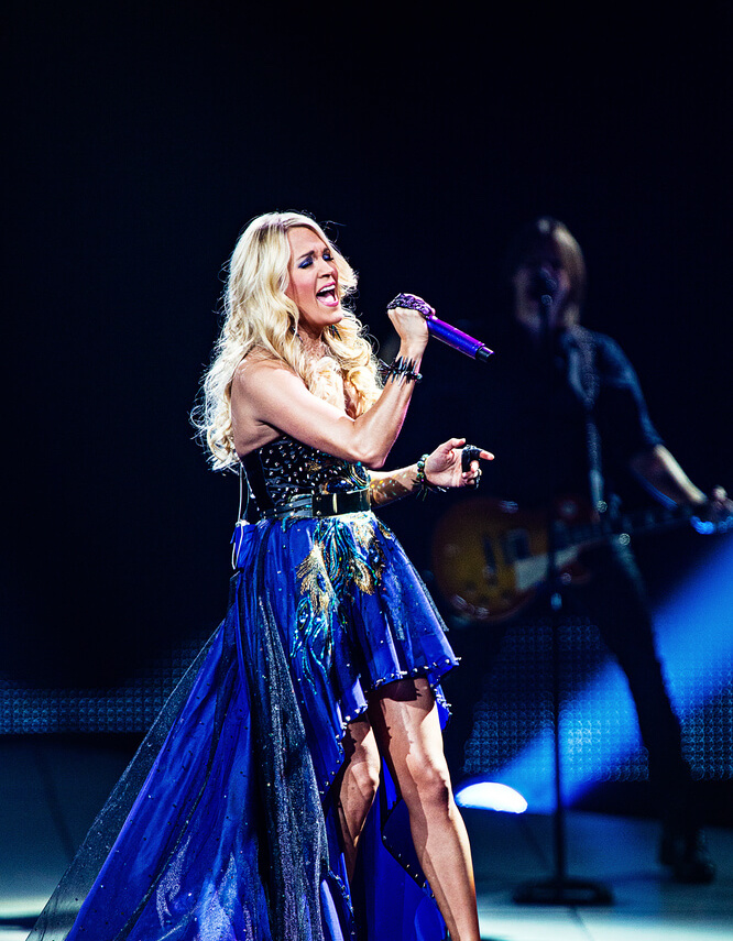 Employees cheering at a concert